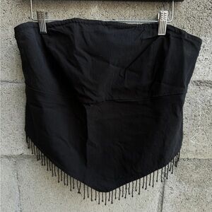 Strapless top with beaded fringe.